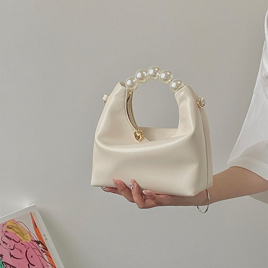 Mini sac en cuir et perles dorée